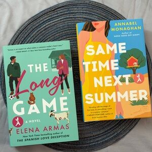 Two hardcover romance novels | Elena Armas and Annabel Monaghan